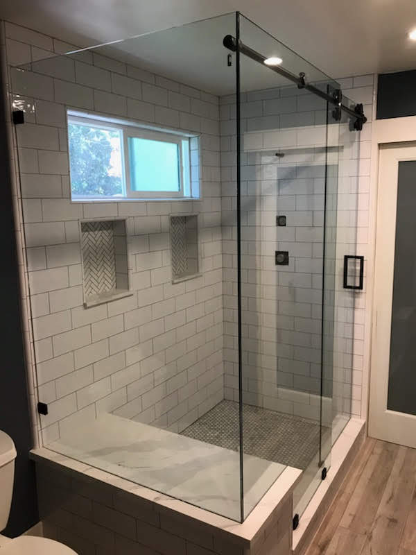 Heavy Frameless Showers Infuse A Sense of Calm Retreat